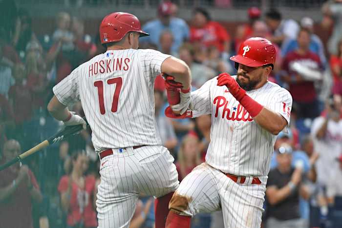 Kyle Schwarber celebrates with Rhys Hoskins at home plate following his home run against the Washington Nationals.